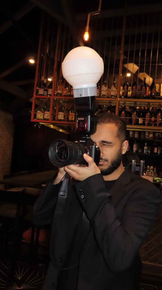 Hamad of Shots by Hamad behind the camera with a flash